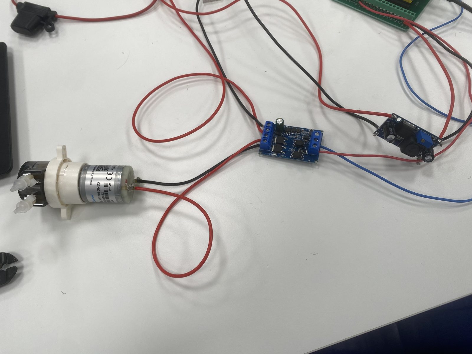 Peristaltic pump wired through the MOSFET module with the buck converter