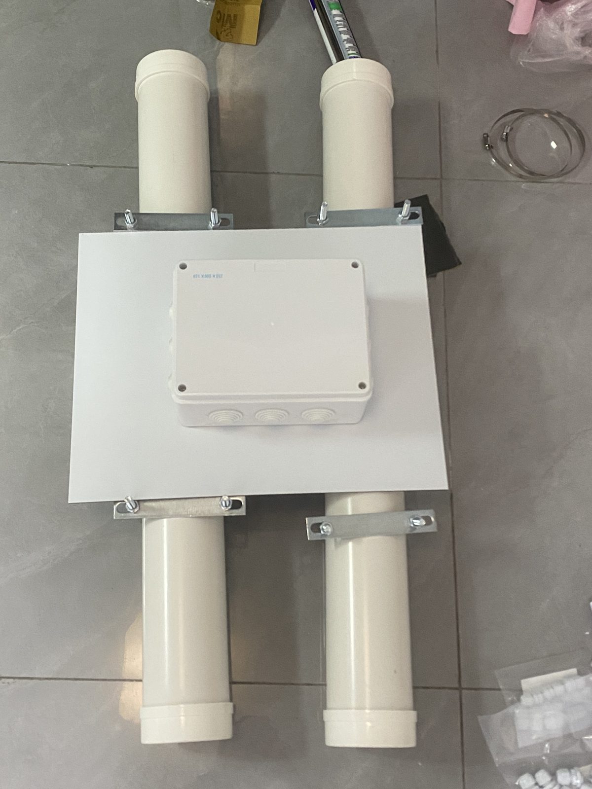 Deck plate with junction box mounted across the two PVC pontoons, viewed from above