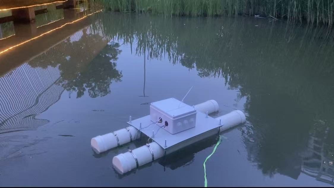 The twin-pontoon vessel floating on a canal at dusk