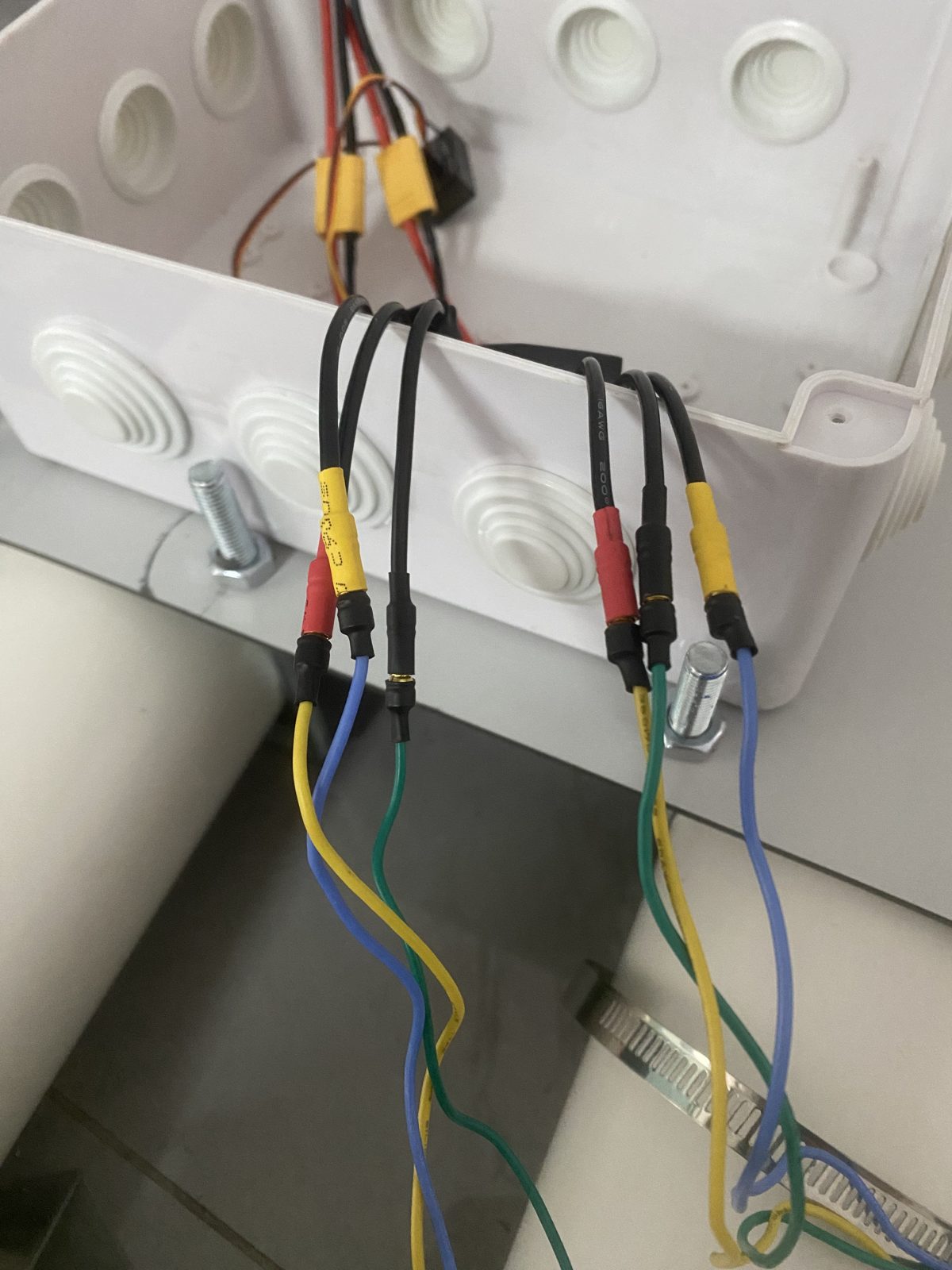 Thruster leads with bullet connectors passing through the cable glands of the enclosure
